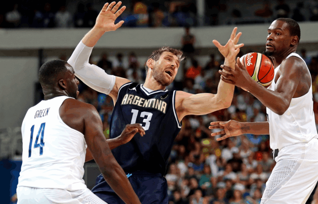 Aug 17, 2016; Rio de Janeiro, Brazil; Argentina small forward Andres Nocioni (13) loose ball control of the ball against USA forward Draymond Green (14) and USA forward Kevin Durant (5) during the men's basketball quarterfinals in the Rio 2016 Summer Olympic Games at Carioca Arena 1. Mandatory Credit: Jeff Swinger-Imagn Images