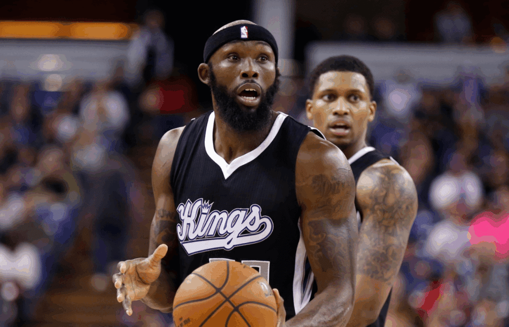Dec 11, 2014; Sacramento, CA, USA; Sacramento Kings forward Reggie Evans (30) and forward Rudy Gay (8) react after the call during the third quarter against the Houston Rockets at Sleep Train Arena. The Houston Rockets defeated the Sacramento Kings 113-109 in overtime. Mandatory Credit: Kelley L Cox-Imagn Images