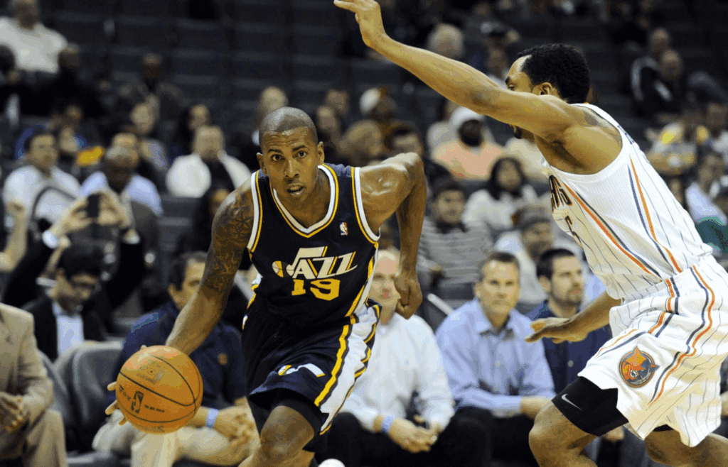 March 7, 2012; Charlotte, NC, USA; Utah Jazz guard Raja Bell (19) drives by Charlotte Bobcats guard Gerald Henderson (15) during the game at Time Warner Cable Arena. Jazz win 99-93. Mandatory Credit: Sam Sharpe-Imagn Images