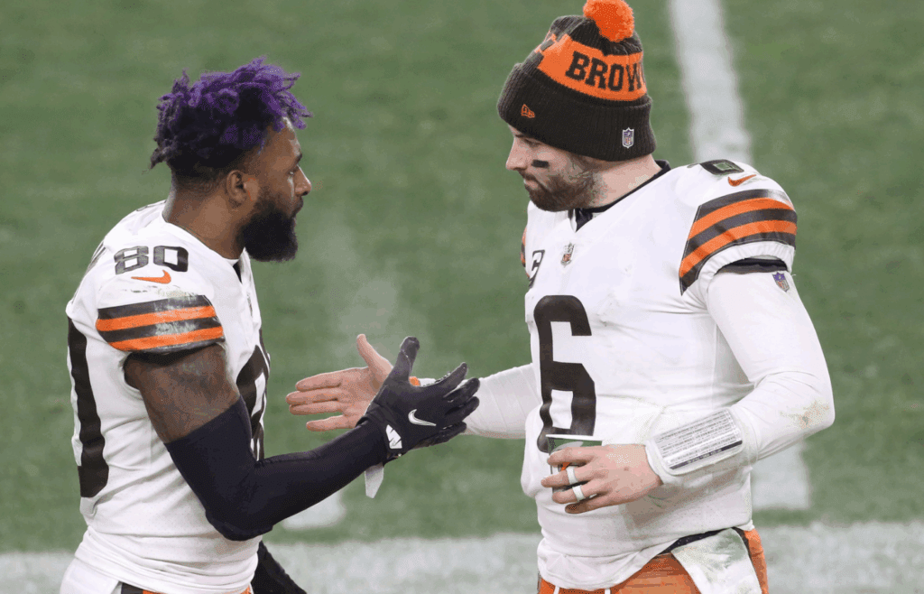 Jan 10, 2021; Pittsburgh, PA, USA; Cleveland Browns quarterback Baker Mayfield (6) celebrates with wide receiver Jarvis Landry (80) on the sideline against the Pittsburgh Steelers in the fourth quarter of an AFC Wild Card playoff game at Heinz Field. Mandatory Credit: Charles LeClaire-Imagn Images