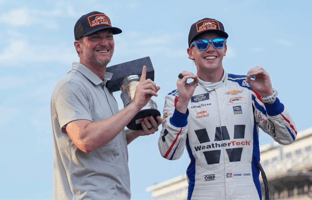 Dale Earnhardt Jr. smiles for a photo with NASCAR Xfinity Series driver Connor Zilisch (88) on Saturday, July 26, 2025, after winning the Pennzoil 250 at Indianapolis Motor Speedway.