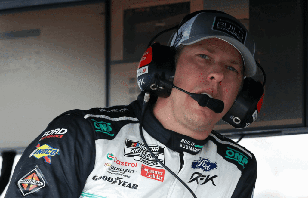 Jun 21, 2025; Long Pond, Pennsylvania, USA; NASCAR Cup Series driver Brad Keselowski looks on from the pits during practice and qualifying for The Great American Getaway 400 at Pocono Raceway. Mandatory Credit: Matthew O'Haren-Imagn Images
