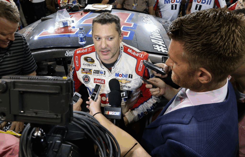 Nov 20, 2016; Homestead, FL, USA; NASCAR Sprint Cup Series driver Tony Stewart (14) is interview after his last race after the Ford Ecoboost 400 at Homestead-Miami Speedway. Mandatory Credit: Peter Casey-Imagn Images