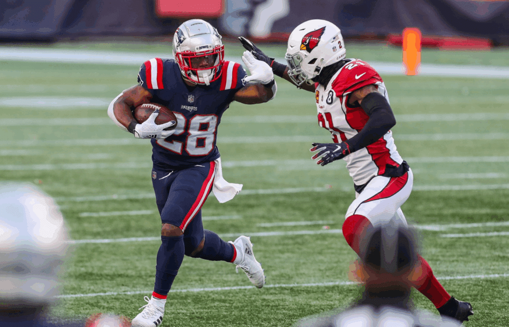 Nov 29, 2020; Foxborough, Massachusetts, USA; New England Patriots running back James White (28) runs the ball against the Arizona Cardinals during the second half at Gillette Stadium. Mandatory Credit: Paul Rutherford-Imagn Images