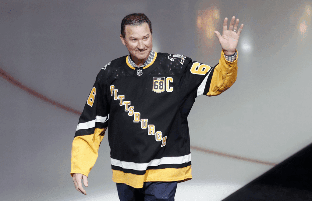 Feb 18, 2024; Pittsburgh, Pennsylvania, USA; Pittsburgh Penguins former center Mario Lemieux waves to the crowd during a ceremony to retire the jersey number of Penguins former right wing Jaromir Jagr (not pictured) at PPG Paints Arena. The Penguins hosted the Los Angeles Kings after the ceremony. Los Angeles won 2-1. Mandatory Credit: Charles LeClaire-Imagn Images