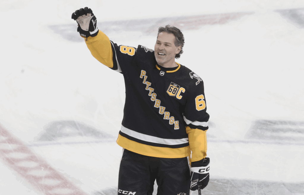 Feb 18, 2024; Pittsburgh, Pennsylvania, USA; Pittsburgh Penguins former right wing Jaromir Jagr (68) waves to the crowd at the conclusion of warm-ups against the Los Angeles Kings at PPG Paints Arena. Mandatory Credit: Charles LeClaire-Imagn Images