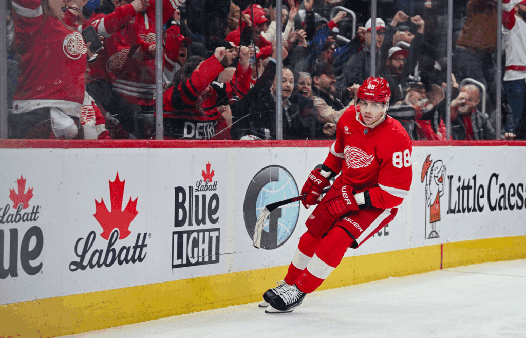 Apr 4, 2025; Detroit, Michigan, USA; Detroit Red Wings right wing Patrick Kane (88) as fans celebrate his goal during the second period against the Carolina Hurricanes at Little Caesars Arena. Mandatory Credit: Tim Fuller-Imagn Images