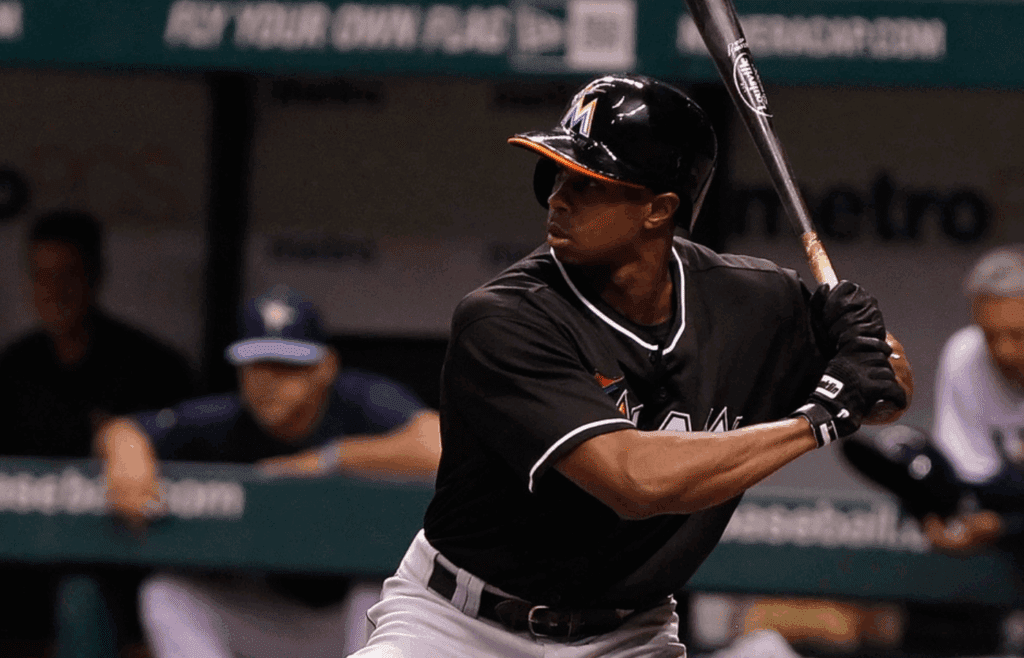 May 28, 2013; St. Petersburg, FL, USA; Miami Marlins left fielder Juan Pierre (9) at bat against the Tampa Bay Rays at Tropicana Field. Mandatory Credit: Kim Klement-Imagn Images