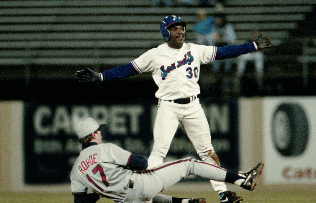 Chicago White Sox star Tim Raines (30), on a three-game medical rehabilitation stint with the Nashville Sounds, pleads with the umpire, but is called out on a steal attempt after Buffalo Bisons infielder Dave Rohde (17) made the tag. Raines, on his last night with the Sounds, delivered a two-out, two-run seventh-inning single to help them to a 4-3 victory at Greer Stadium May 21, 1993.