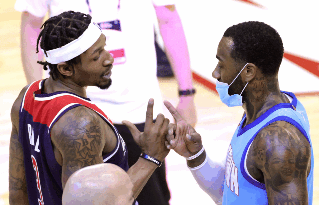 Jan 26, 2021; Houston, Texas, USA; Houston Rockets guard John Wall (right) greets Washington Wizards guard Bradley Beal (3) after a game at the Toyota Center. Mandatory Credit: Carmen Mandato/Pool Photo-Imagn Images