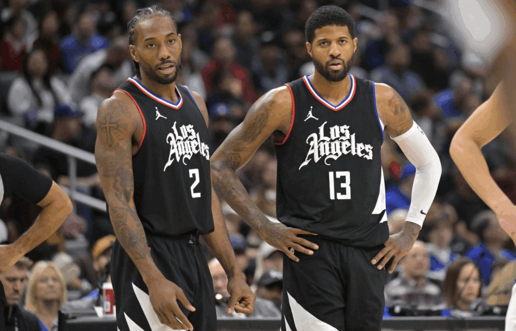 Feb 10, 2024; Los Angeles, California, USA; Los Angeles Clippers forward Kawhi Leonard (2) and forward Paul George (13) look on in the second half against the Detroit Pistons at Crypto.com Arena. Mandatory Credit: Jayne Kamin-Oncea-Imagn Images