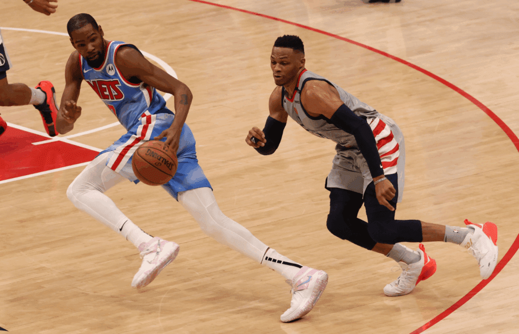 Jan 31, 2021; Washington, District of Columbia, USA; Washington Wizards guard Russell Westbrook (4) attempts to steal the ball from Brooklyn Nets forward Kevin Durant (7) in the final seconds in the fourth quarter at Capital One Arena. Mandatory Credit: Geoff Burke-Imagn Images