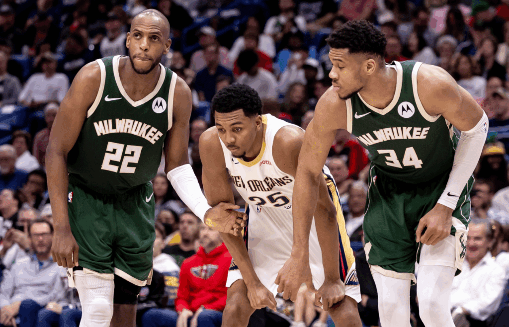 Mar 28, 2024; New Orleans, Louisiana, USA; Milwaukee Bucks forward Khris Middleton (22) and forward Giannis Antetokounmpo (34) block New Orleans Pelicans guard Trey Murphy III (25) on a free throw attempt during the second half at Smoothie King Center. Mandatory Credit: Stephen Lew-Imagn Images
