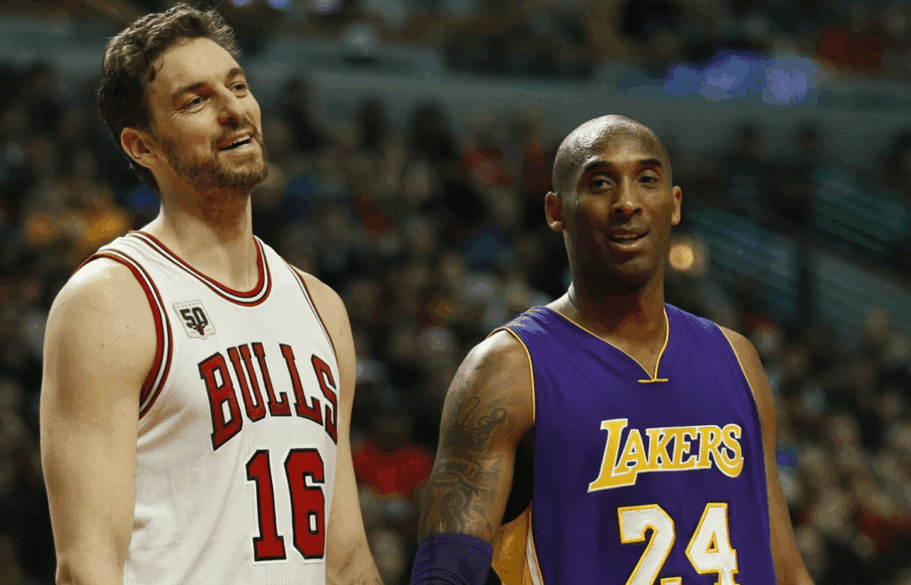 Feb 21, 2016; Chicago, IL, USA; Chicago Bulls center Pau Gasol (16) talks with Los Angeles Lakers forward Kobe Bryant (24) during the first half at United Center. Mandatory Credit: Kamil Krzaczynski-Imagn Images