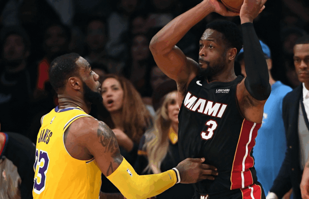 Dec 10, 2018; Los Angeles, CA, USA; Los Angeles Lakers forward LeBron James (23) stops Miami Heat guard Dwyane Wade (3) from making a shot on the last play of the game in the fourth quarter at Staples Center. Mandatory Credit: Jayne Kamin-Oncea-Imagn Images