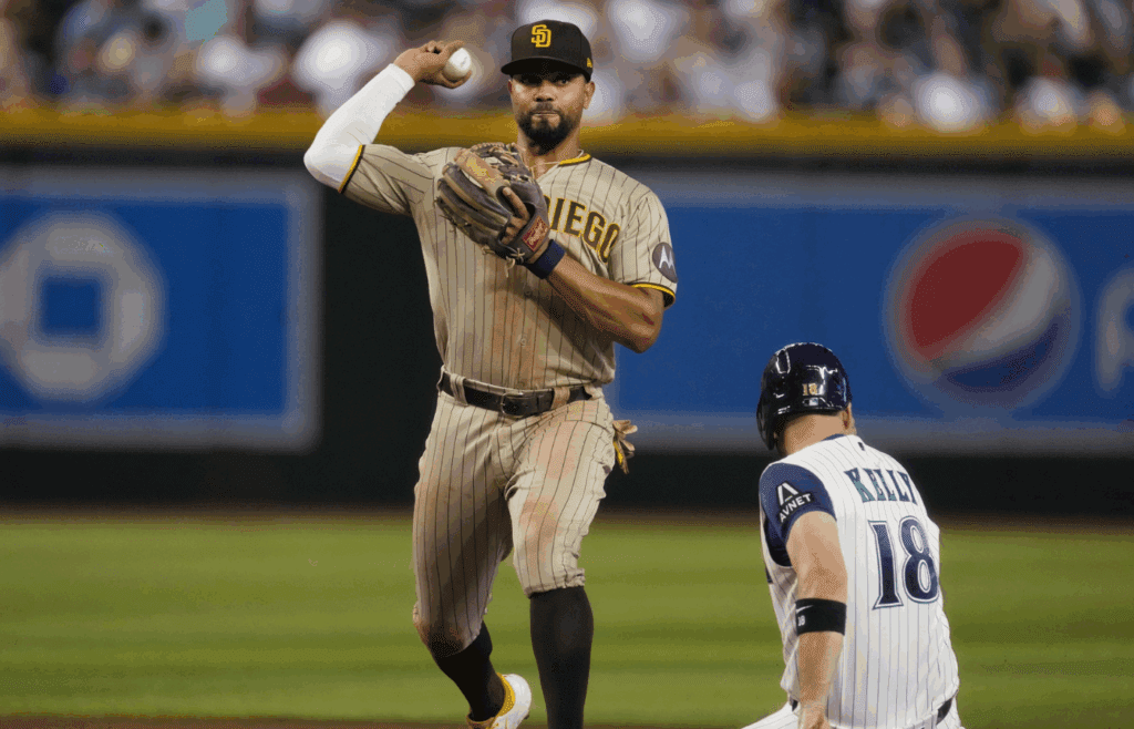 Aug 12, 2023; Phoenix, AZ, USA; San Diego Padres short stop Xander Bogaerts (2) sttempts a double play as he throws the ball over the head of Arizona Diamondbacks' Carson Kelly (18) at Chase Field.