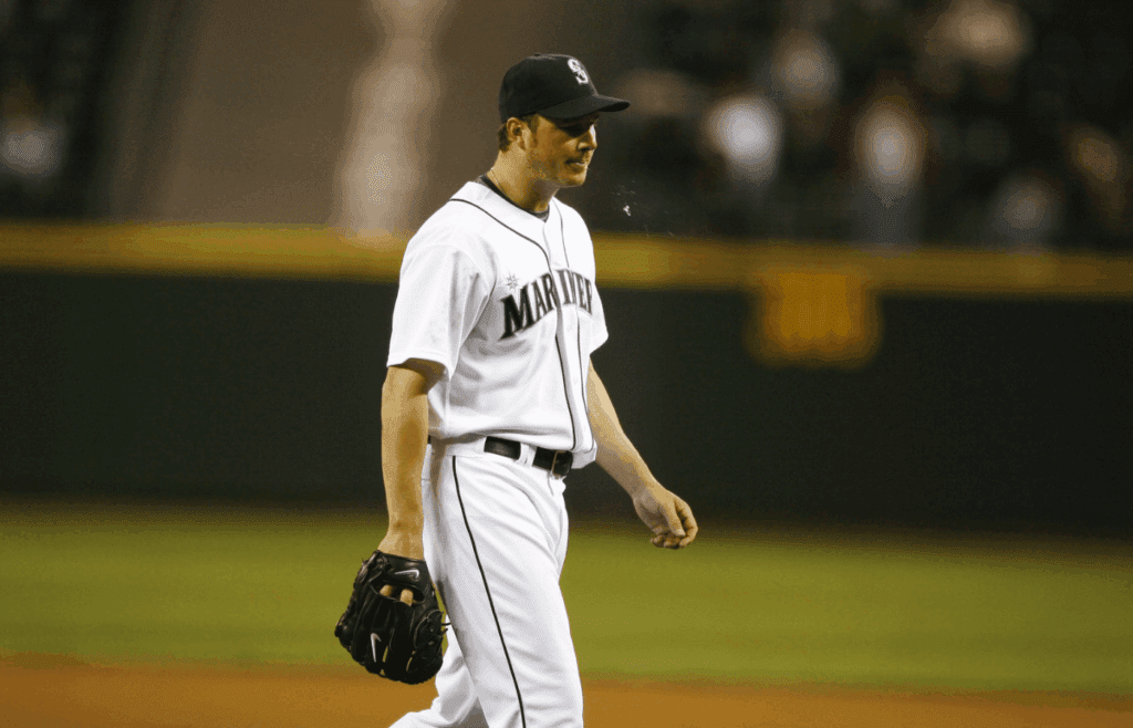 Jun 3, 2008; Seattle, WA, USA; Seattle Mariners starting pitcher Erik Bedard, right, is relieved after in the fourth inning of a 5-4 loss against the Los Angeles Angels at Safeco Field. Mandatory Credit: Joe Nicholson-Imagn Images