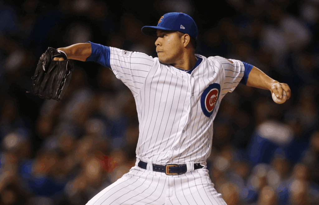 Oct 19, 2017; Chicago, IL, USA; Chicago Cubs starting pitcher Jose Quintana throws a pitch against the Los Angeles Dodgers in the first inning in game five of the 2017 NLCS playoff baseball series at Wrigley Field. Mandatory Credit: Dennis Wierzbicki-Imagn Images