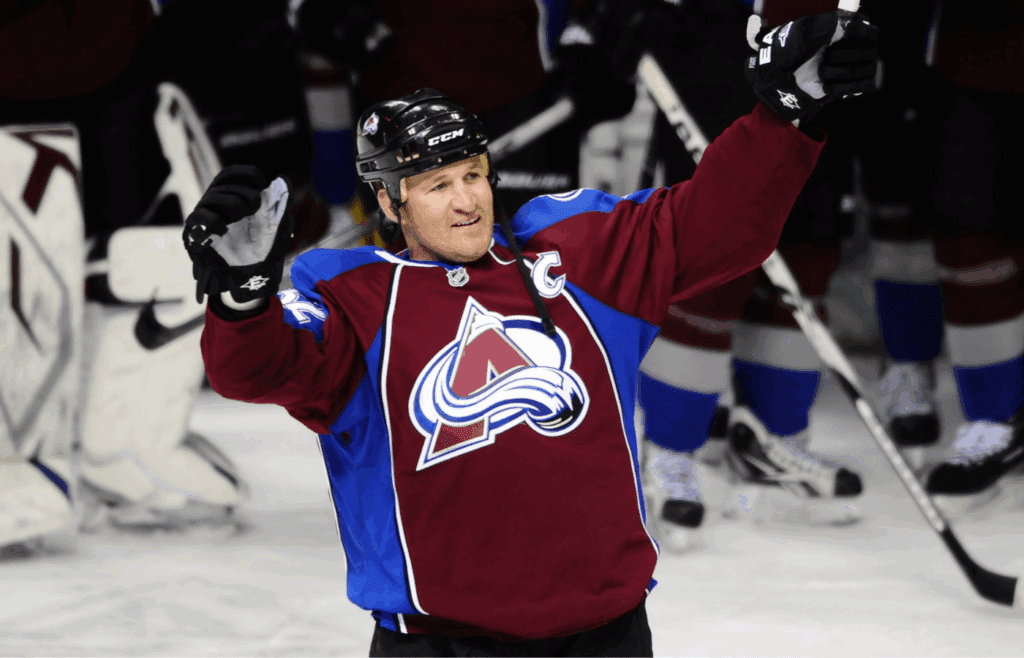 April 10 2011; Denver, CO, USA; Colorado Avalanche defenseman Adam Foote (52) reacts to the standing ovation by the fans at the end of the game against the Edmonton Oilers at the Pepsi Center. The Avalanche defeated the Oilers in overtime, 4-3. Mandatory Credit: Ron Chenoy-Imagn Images