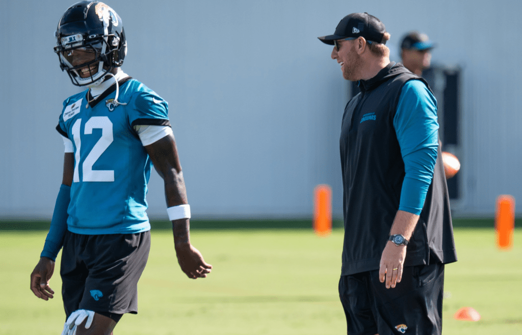 Jacksonville Jaguars wide receiver Travis Hunter (12) has a laugh with Jacksonville Jaguars head coach Liam Coen during the Jacksonville Jaguars’ third mandatory minicamp Thursday June 12, 2025 at the Miller Electric Center in Jacksonville, Fla. [Doug Engle/Florida Times-Union]