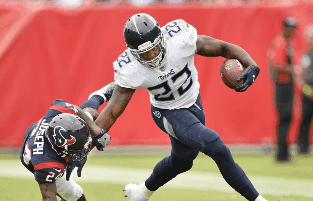 Tennessee Titans running back Derrick Henry (22) gains yards push off Houston Texans cornerback Johnathan Joseph (24) at Nissan Stadium in Nashville on Sept. 16, 2018. The Titans won their home opener 20-17.