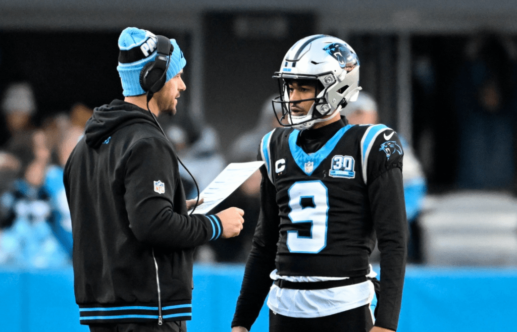 Dec 22, 2024; Charlotte, North Carolina, USA; Carolina Panthers head coach Dave Canales with quarterback Bryce Young (9) in the fourth quarter at Bank of America Stadium. Mandatory Credit: Bob Donnan-Imagn Images