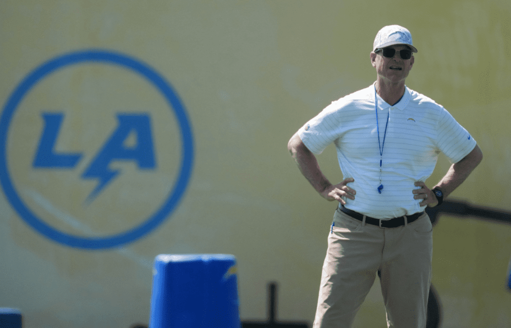 May 20, 2025; El Segundo, CA, USA; Los Angeles Chargers coach Jim Harbaugh looks on during offseason workouts at The Bolt. Mandatory Credit: Kirby Lee-Imagn Images