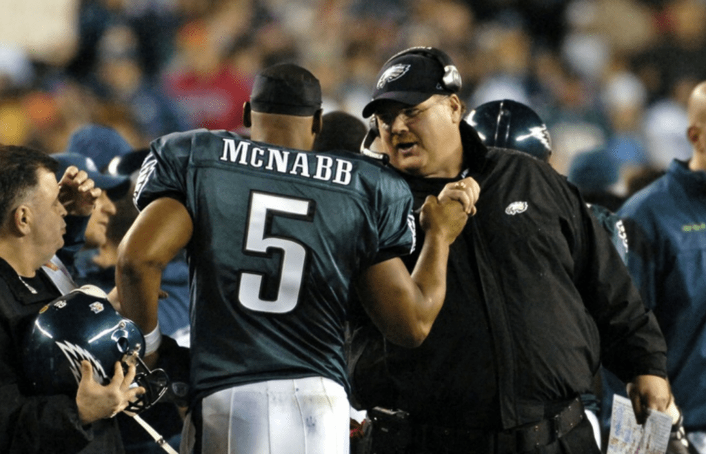 December 15, 2008; Philadelphia, PA USA; Philadelphia Eagles quarterback Donovan McNabb (5) is congratulated from head coach Andy Reid after McNabb threw touchdown pass in fourth quarter of the 30-10 win over the Cleveland Browns at Lincoln Financial Field. Mandatory Credit: Eric Hartline-Imagn Images