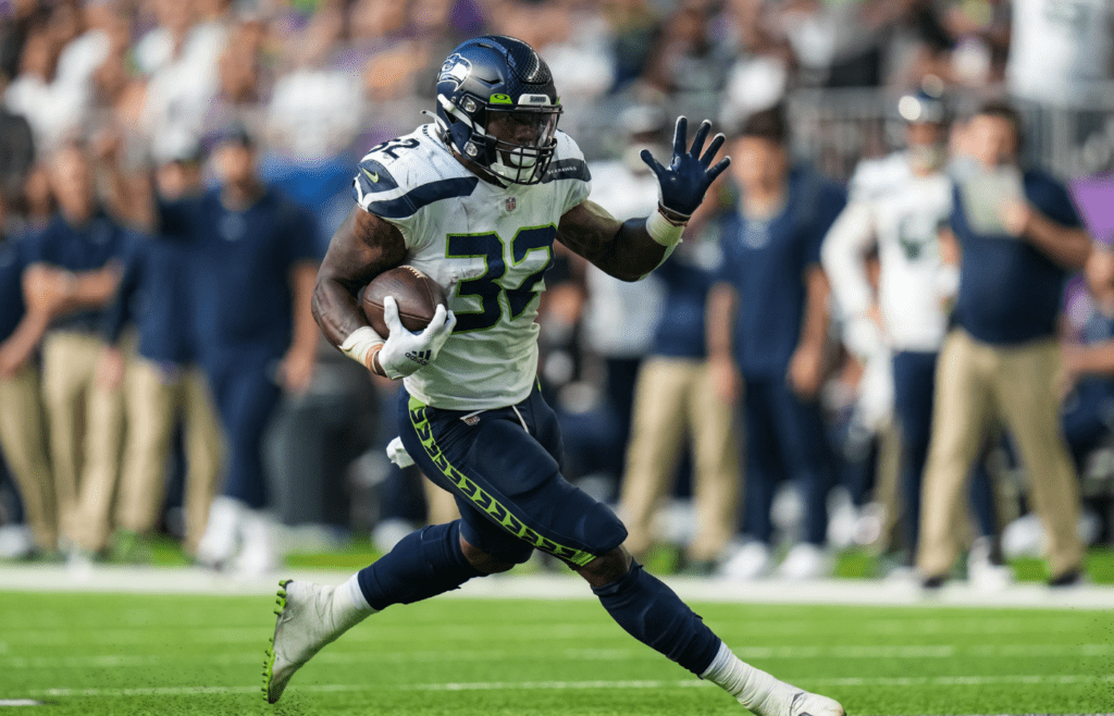 Sep 26, 2021; Minneapolis, Minnesota, USA; Seattle Seahawks running back Chris Carson (32) carries the ball during the second quarter against Minnesota Vikings at U.S. Bank Stadium. Mandatory Credit: Brace Hemmelgarn-Imagn Images