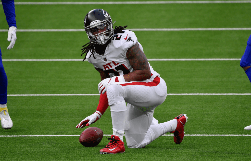Dec 13, 2020; Inglewood, California, USA; Atlanta Falcons running back Todd Gurley (21) after a short gain in the first quarter against the Los Angeles Chargers at SoFi Stadium. Mandatory Credit: Robert Hanashiro-Imagn Images