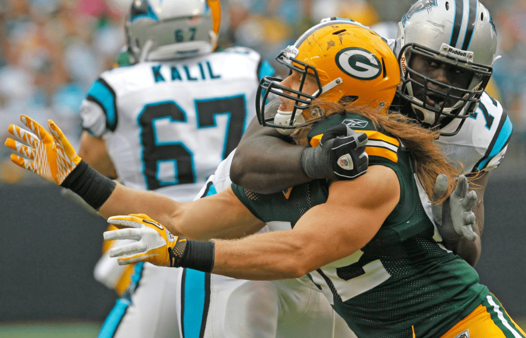 Carolina Panthers rookie offensive tackle Byron Bell holds Green Bay Packers linebacker Clay Matthews during the third quarter of their game on September 18, 2011, at Bank of America Stadium in Charlotte, N.C. The Green Bay Packers prevailed over the Carolina Panthers 30-23.