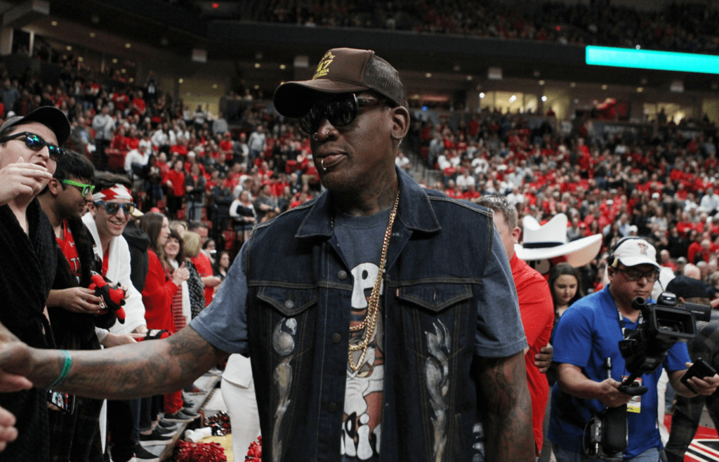 Feb 29, 2020; Lubbock, Texas, USA; NBA Hall of Fame member Dennis Rodman greets the crowd during the game between the Texas Tech Red Raiders and the Texas Longhorns at United Supermarkets Arena. Mandatory Credit: Michael C. Johnson-Imagn Images