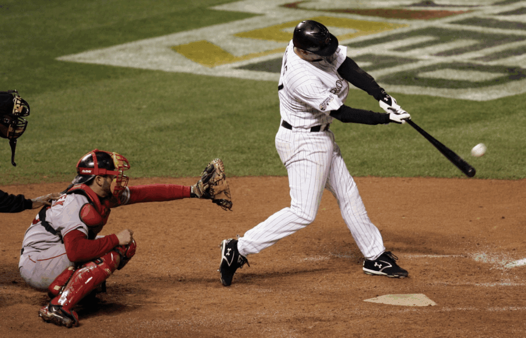 Oct 28, 2007; Denver, CO, USA; Colorado Rockies third baseman Garrett Atkins (27) hits a two-run home run during the eighth inning of game 4 of the 2007 World Series against the Boston Red Sox at Coors Field. Mandatory Credit: Jerry Lai-Imagn Images