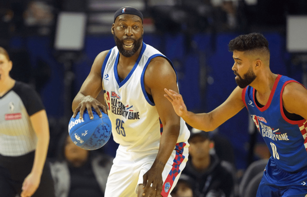 Feb 14, 2025; Oakland, California, USA; Baron Davis (85) of Team Bonds dribbles the ball against AP Dhillon (10) of Team Rice during the celebrity game ahead of the 2025 NBA All Star Game at Oakland Arena. Mandatory Credit: Darren Yamashita-Imagn Images