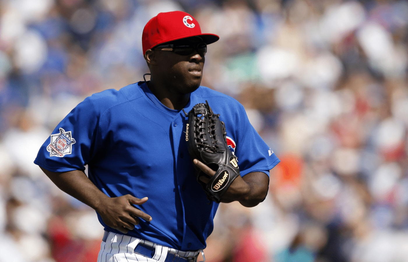 Chicago Cubs right fielder Milton Bradley (21) returns to the dugout after the top half of the ninth inning against the Milwaukee Brewers at Wrigley Field. The Cubs won 2-1 in 10 innings.