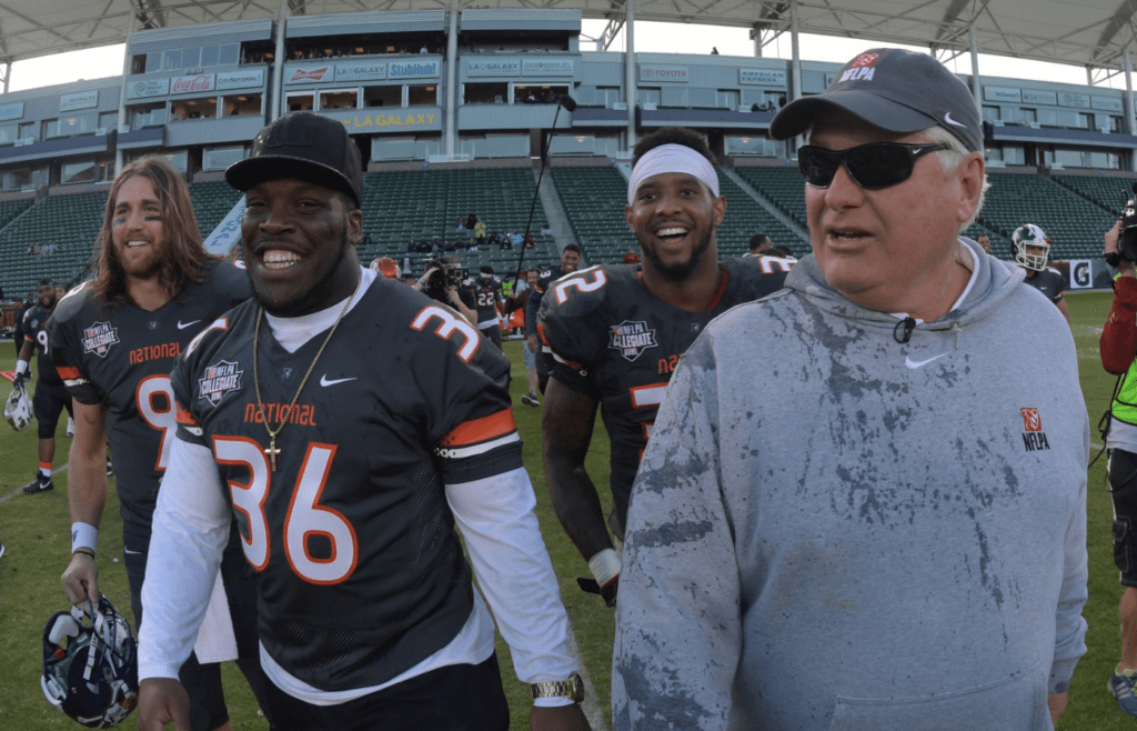 Jan 21, 2017; Carson, CA, USA; National coach Mike Martz and National quarterback Philip Nelson of East Carolina (9), fullback Marquez Williams of Miami (36) and defensive back Maurice Smith of Georgia (32) celebrate after the 2017 NFLPA Collegiate Bowl against the American team at StubHub Center. The National team defeated the American team 27-7. Mandatory Credit: Kirby Lee-Imagn Images
