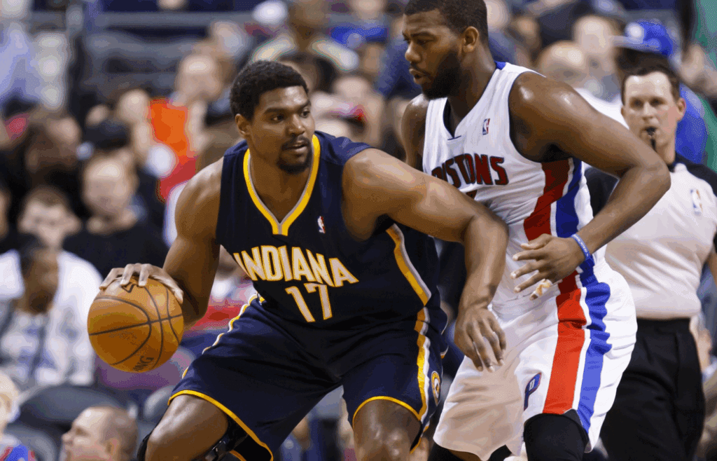 Mar 15, 2014; Auburn Hills, MI, USA; Indiana Pacers center Andrew Bynum (17) is defended by Detroit Pistons forward Greg Monroe (10) in the second quarter at The Palace of Auburn Hills. Mandatory Credit: Rick Osentoski-Imagn Images
