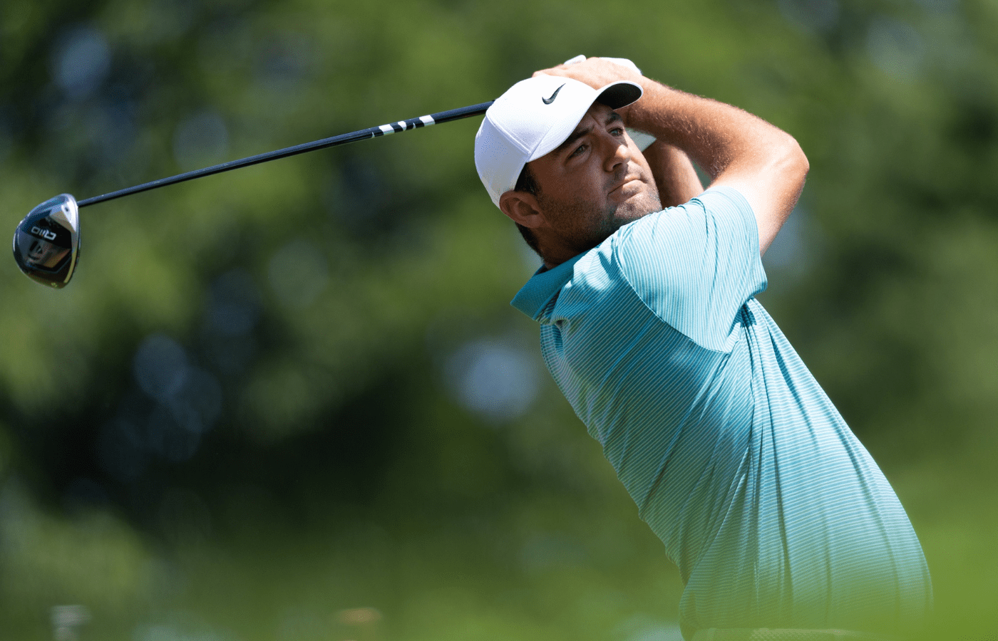 Jun 22, 2025; Cromwell, Connecticut, USA; Scottie Scheffler plays his shot from the first tee during the final round of the Travelers Championship golf tournament. Mandatory Credit: Bill Streicher-Imagn Images