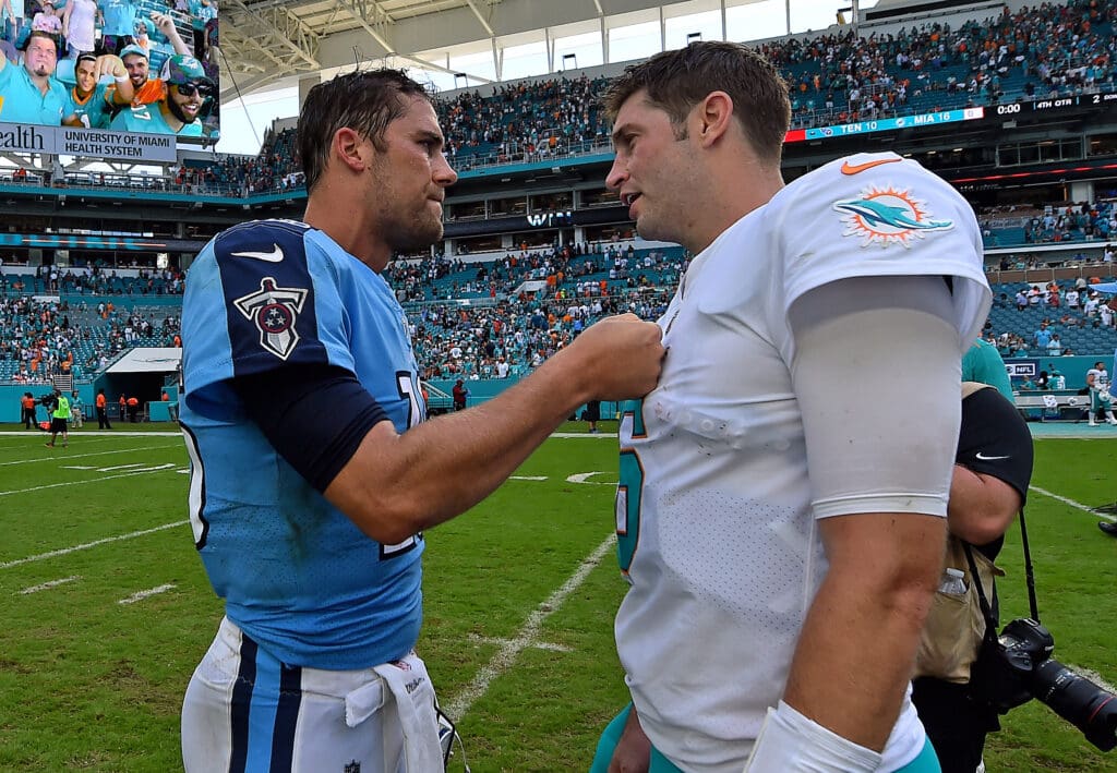 Oct 8, 2017; Miami Gardens, FL, USA; Tennessee Titans quarterback Matt Cassel (16) and Miami Dolphins quarterback Jay Cutler (6) meet midfield after the Miami Dolphins defeat the Tennessee Titans at Hard Rock Stadium. Mandatory Credit: Jasen Vinlove-USA TODAY Sports