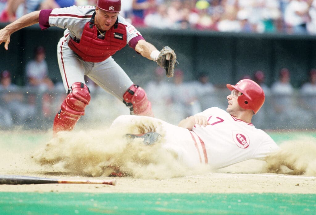 Unknown Date and Location, USA; FILE PHOTO; Cincinnati Reds third baseman Chris Sabo slides into home against Philadelphia Phillies catcher Darren Daulton. Mandatory Credit: RVR Photos-USA TODAY NETWORK