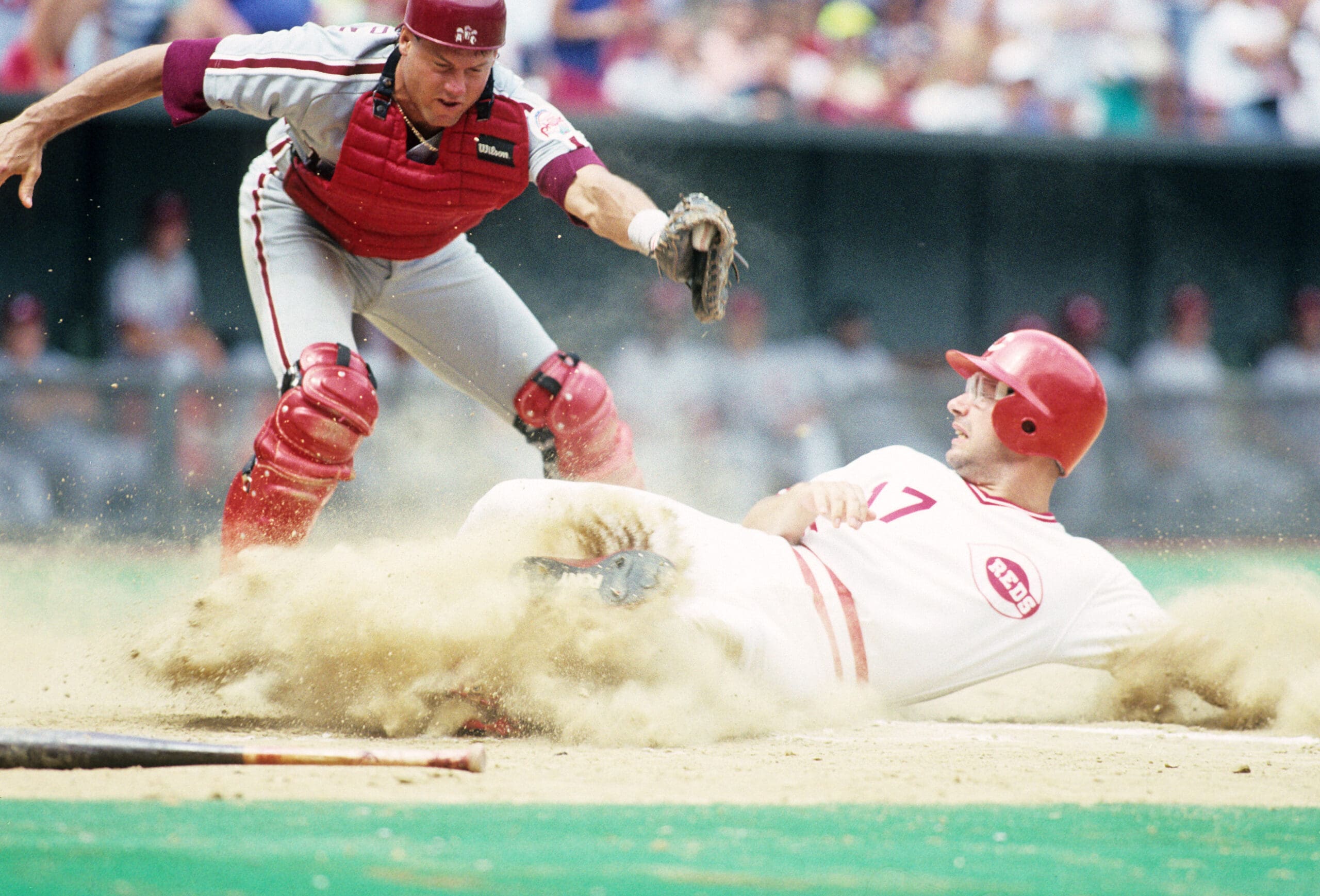 Unknown Date and Location, USA; FILE PHOTO; Cincinnati Reds third baseman Chris Sabo slides into home against Philadelphia Phillies catcher Darren Daulton. Mandatory Credit: RVR Photos-USA TODAY NETWORK