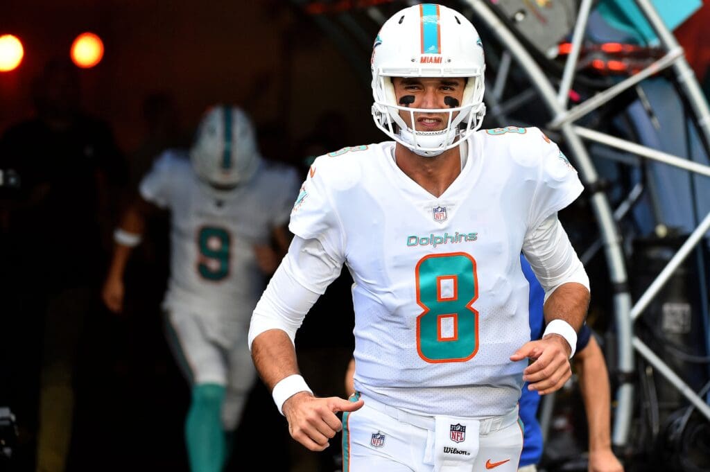 Oct 21, 2018; Miami Gardens, FL, USA; Miami Dolphins quarterback Brock Osweiler (8) runs onto the field prior to the game against the Detroit Lions at Hard Rock Stadium. Mandatory Credit: Jasen Vinlove-Imagn Images