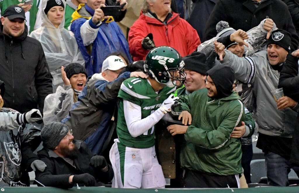 Nov 24, 2019; East Rutherford, NJ, USA; New York Jets wide receiver Robby Anderson (11) celebrates with fans after scoring on a 5-yard touchdown in the third quarter against the Oakland Raiders at MetLife Stadium. Mandatory Credit: Kirby Lee-USA TODAY Sports