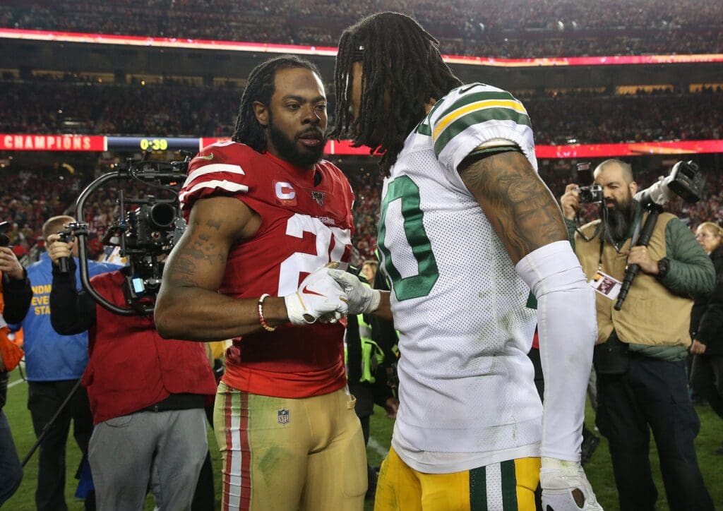 Jan 19, 2020; Santa Clara, California, USA; San Francisco 49ers cornerback Richard Sherman (25) meets with Green Bay Packers cornerback Kevin King (20) following the 37-20 victory in the NFC Championship Game at Levi's Stadium. Mandatory Credit: Cary Edmondson-USA TODAY Sports