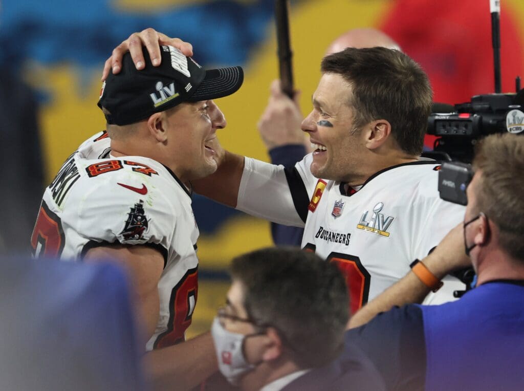 Feb 7, 2021; Tampa, FL, USA; Tampa Bay Buccaneers quarterback Tom Brady (12) and tight end Rob Gronkowski (87) celebrate after defeating the Kansas City Chiefs in Super Bowl LV at Raymond James Stadium. Mandatory Credit: Matthew Emmons-USA TODAY Sports