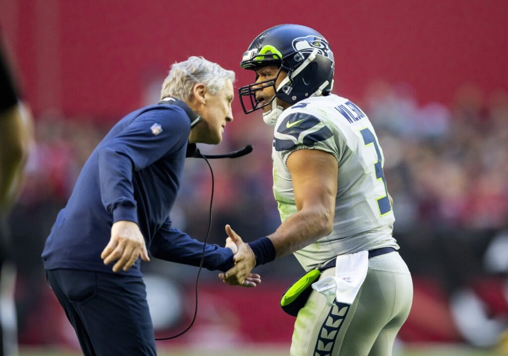 Jan 9, 2022; Glendale, Arizona, USA; Seattle Seahawks quarterback Russell Wilson (3) celebrates a touchdown with head coach Pete Carroll against the Arizona Cardinals in the first half at State Farm Stadium. Mandatory Credit: Mark J. Rebilas-USA TODAY Sports
