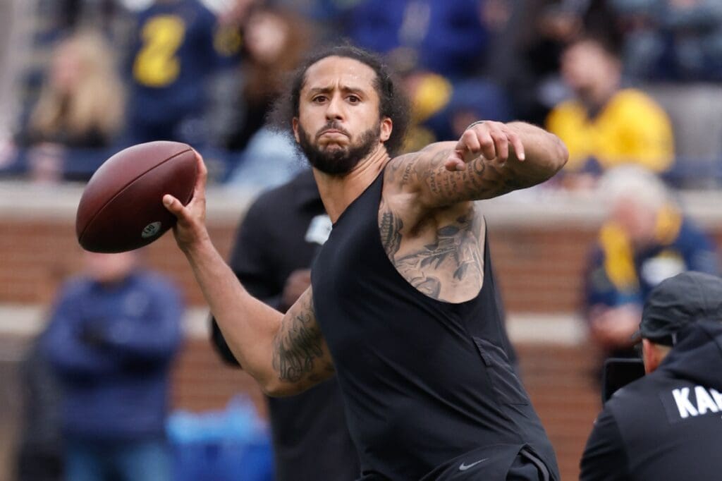 Apr 2, 2022; Ann Arbor, Michigan, USA; Colin Kaepernick passes during halftime at the Michigan Spring game at Michigan Stadium. Mandatory Credit: Rick Osentoski-USA TODAY Sports