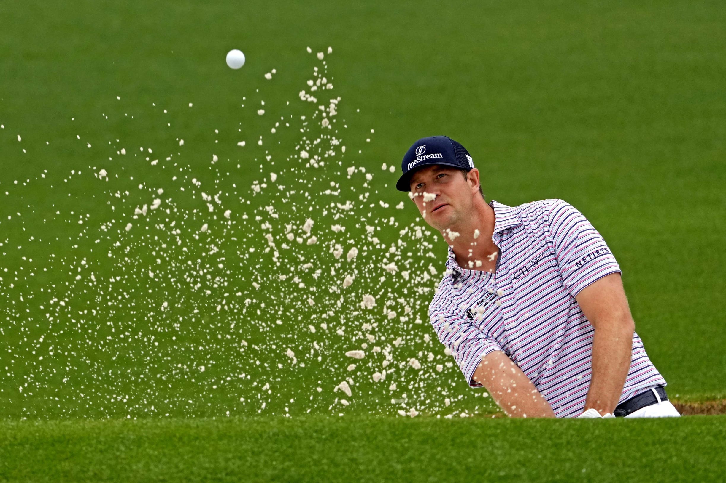Apr 7, 2022; Augusta, Georgia, USA; Hudson Swafford plays a shot from a bunker on the second hole during the first round of The Masters golf tournament. Mandatory Credit: Michael Madrid-USA TODAY Sports