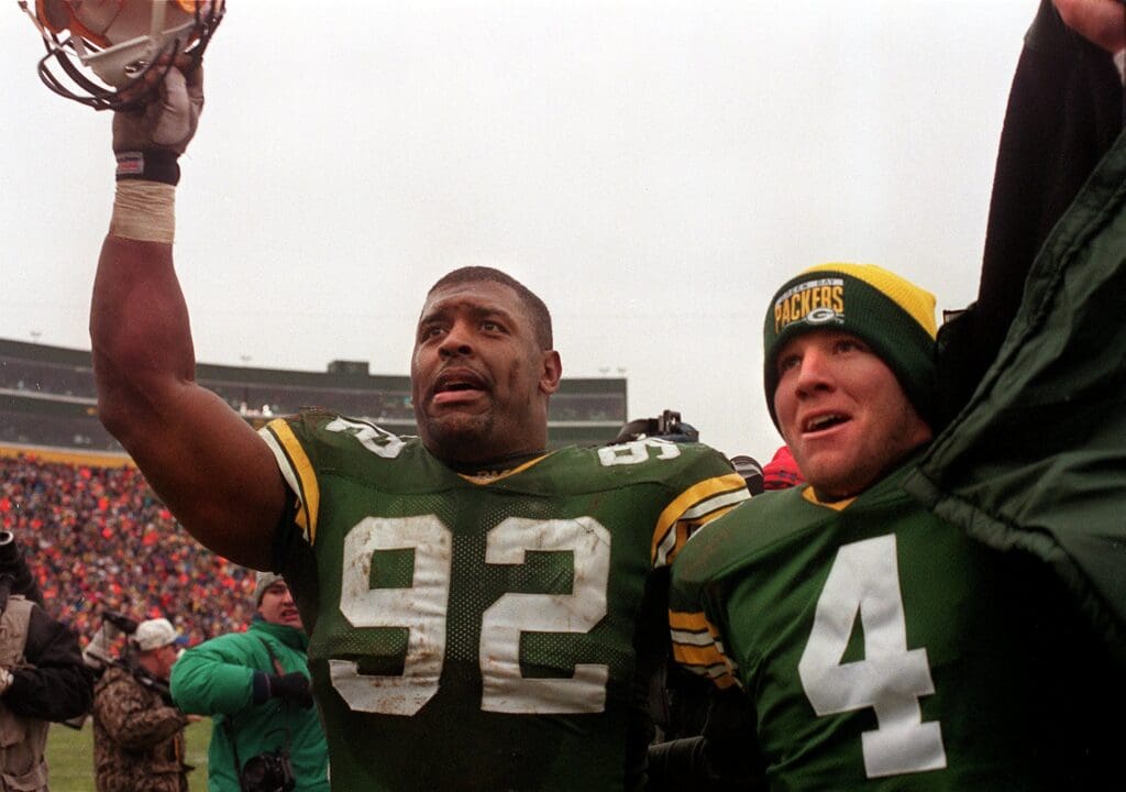 DATE UNKNOWN; Green Bay, WI, USA; FILE PHOTO; Reggie White and Brett Favre leave arm and arm after defeating the Bears at Lambeau Field. Mandatory Credit: Jeffrey Phelps-USA TODAY NETWORK