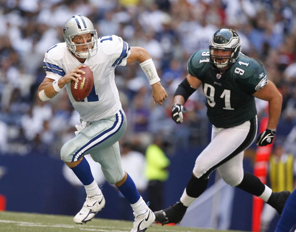 Oct 9, 2005; Irving, TX, USA; Dallas Cowboys quarterback #11 Drew Bledsoe runs out of the pocket against Philadelphia Eagles #91 Sam Rayburn at Texas Stadium. Mandatory Credit: Photo By Matthew Emmons- USA TODAY Sports
